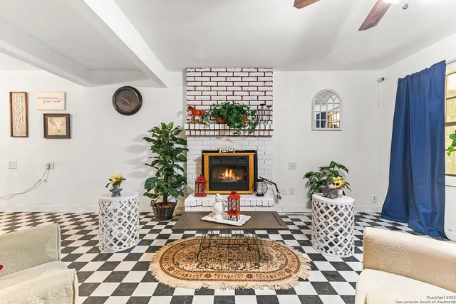 a living room with a couch and a fireplace