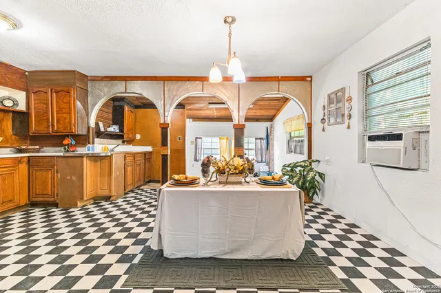 a room with lots of potted plants