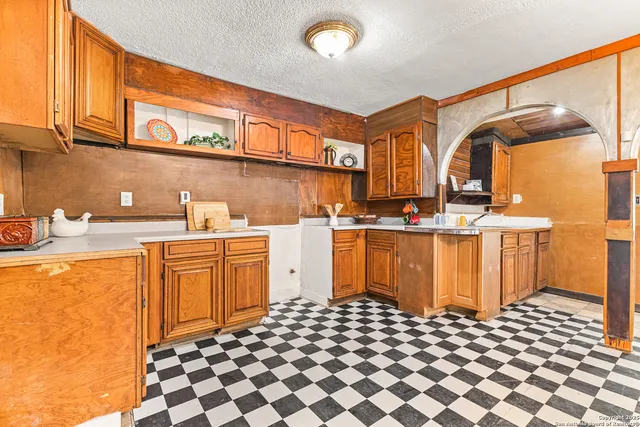 a kitchen with stainless steel appliances granite countertop a sink and a cabinets