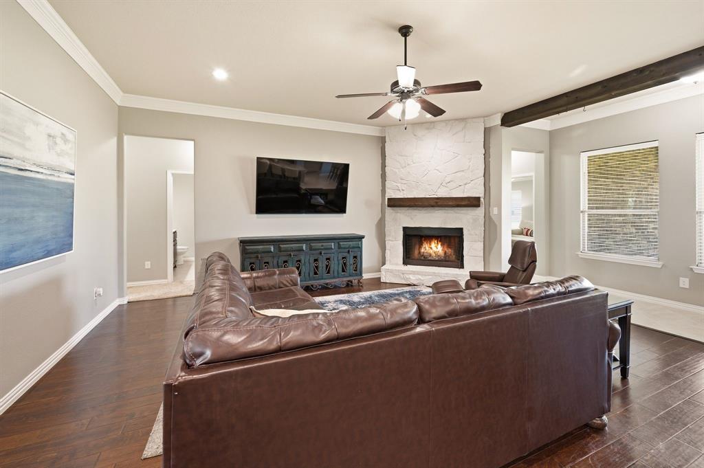 140 Heather Lane Decatur, TX 76234 - Photo 10 of 39 a living room with fireplace furniture and a flat screen tv