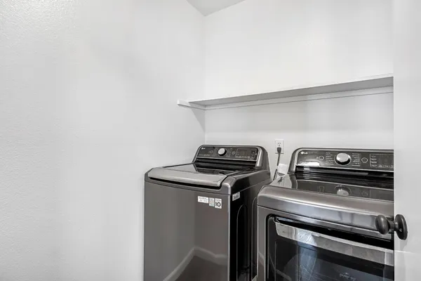 a stove top oven sitting inside of a kitchen