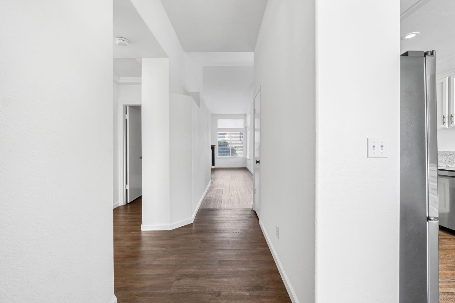 265 West Decatur Avenue Clovis, CA 93611 - Photo 3 of 19 a view of a hallway with wooden floor