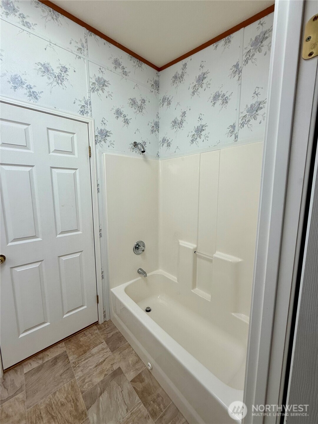 1628 Pleasant Avenue Wenatchee, WA 98801 - Photo 11 of 24 a white bath tub sitting next to a shower curtain