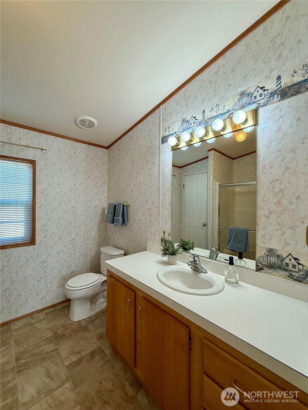 1628 Pleasant Avenue Wenatchee, WA 98801 - Photo 17 of 24 a bathroom with a sink and a mirror