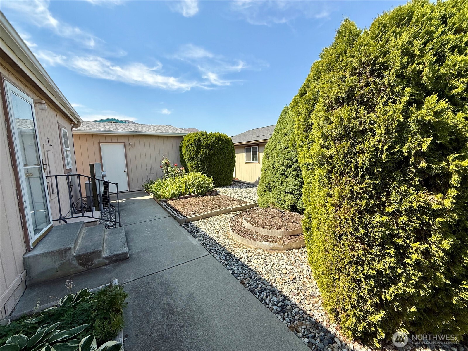 1628 Pleasant Avenue Wenatchee, WA 98801 - Photo 22 of 24 a view of a porch with chairs and potted plants