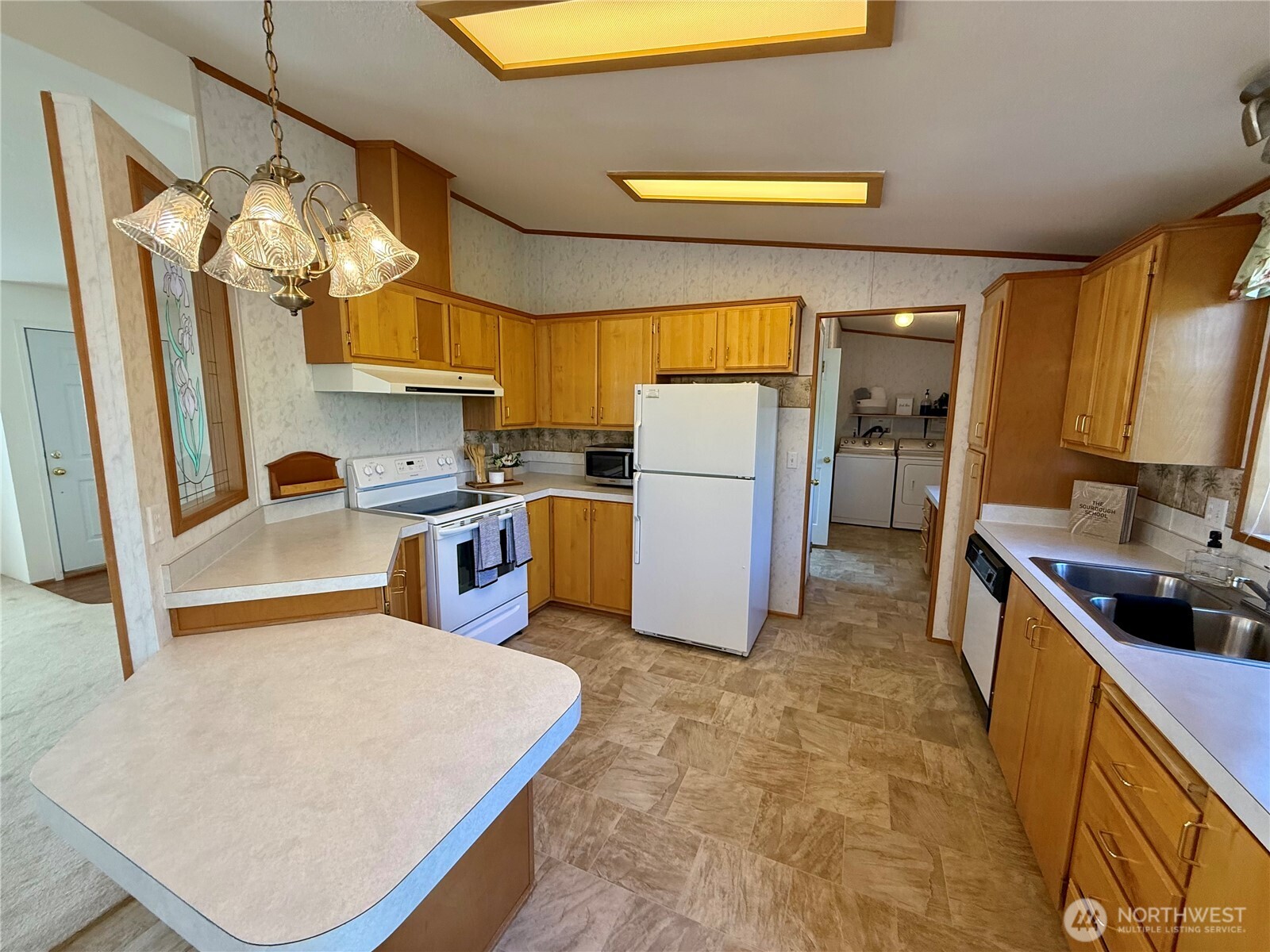 1628 Pleasant Avenue Wenatchee, WA 98801 - Photo 6 of 24 a kitchen with refrigerator and window