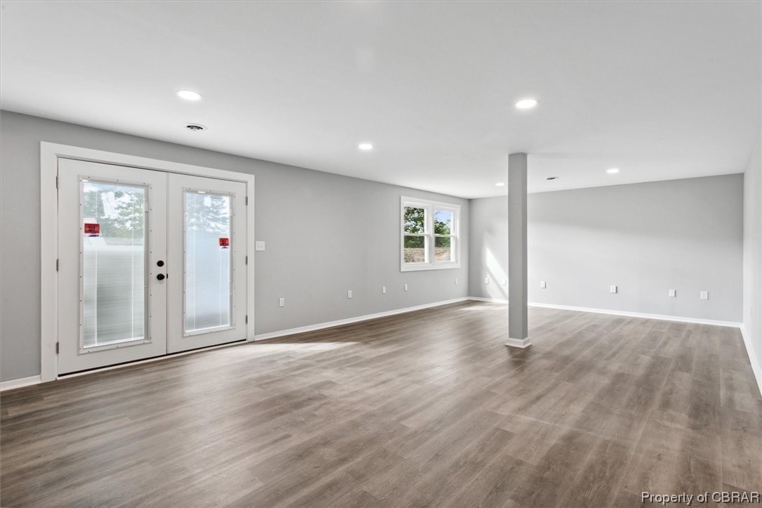 8636 Diascund Road Lanexa, VA 23089 - Photo 29 of 50 Wood floored spare room with french doors