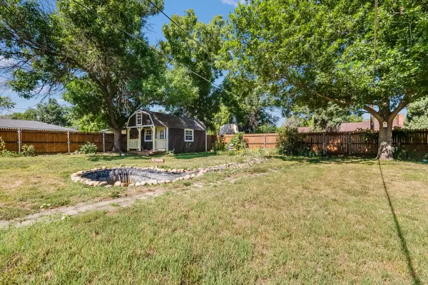 a house with trees in front of it