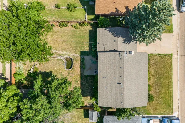 an aerial view of residential houses with outdoor space