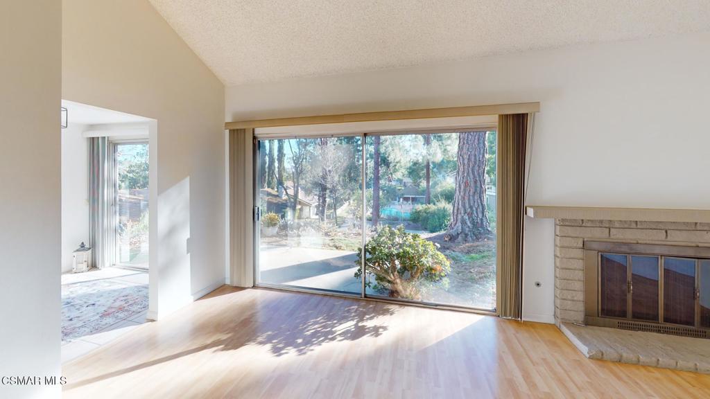 157 Conifer Circle Oak Park, CA 91377 - Photo 12 of 21 a view of a bedroom with wooden floor and front door