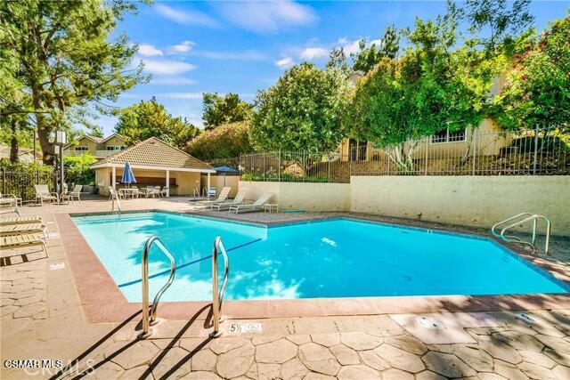 157 Conifer Circle Oak Park, CA 91377 - Photo 19 of 21 a view of a swimming pool with a patio