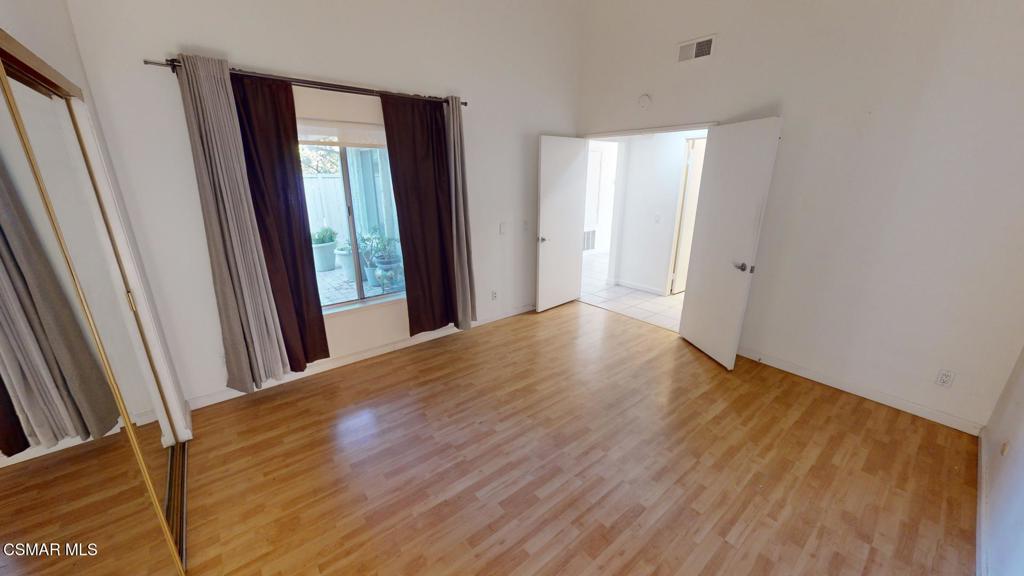 157 Conifer Circle Oak Park, CA 91377 - Photo 6 of 21 a view of a room with wooden floor and window