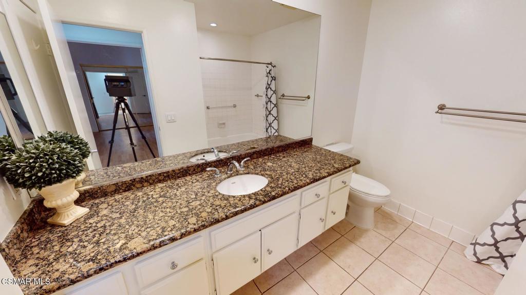 157 Conifer Circle Oak Park, CA 91377 - Photo 7 of 21 a bathroom with a sink and a mirror