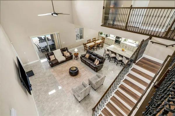 a kitchen with stainless steel appliances white cabinets and a stove top oven