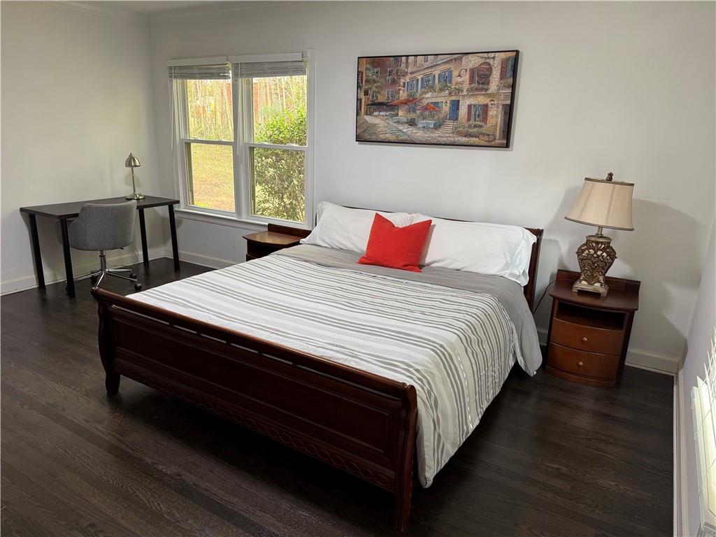 1140 Goodwin Place Northeast, Unit 4 Atlanta, GA 30319 - Photo 15 of 50 a bed sitting in a bedroom next to a window