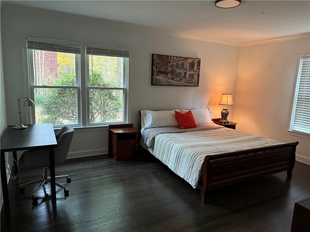 1140 Goodwin Place Northeast, Unit 4 Atlanta, GA 30319 - Photo 16 of 50 a bedroom with a bed a table and a window