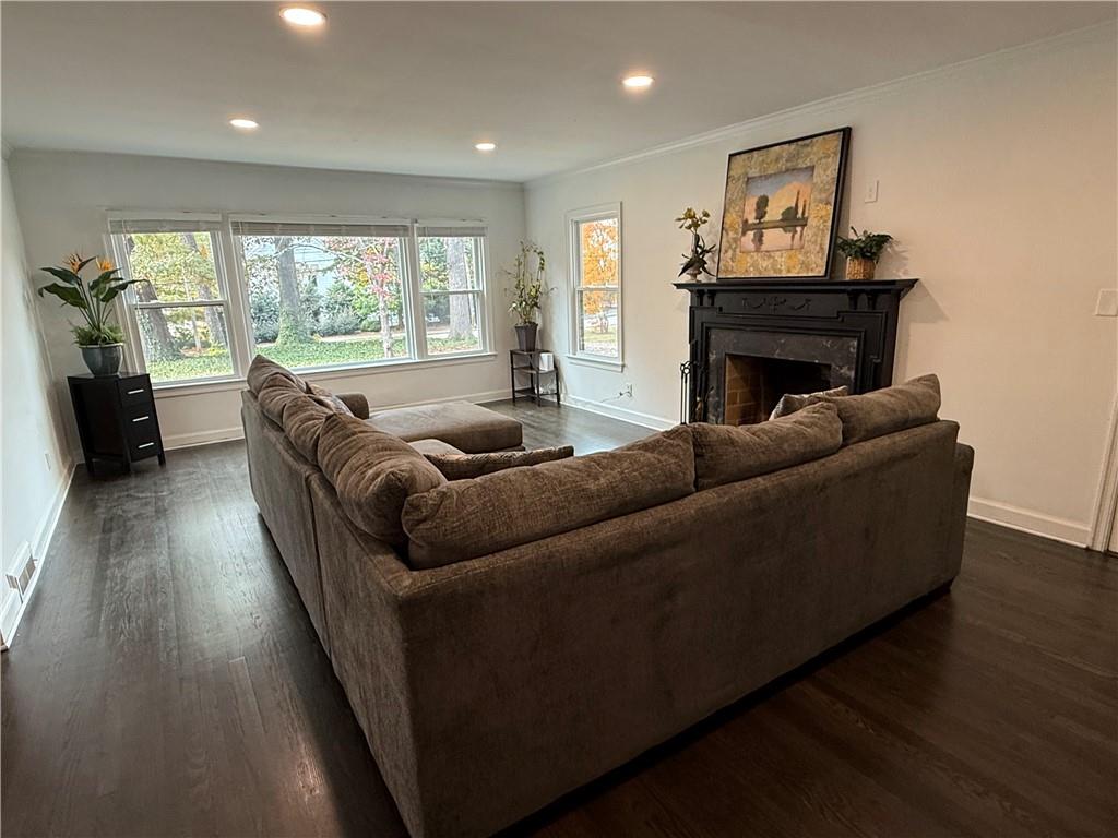 1140 Goodwin Place Northeast, Unit 4 Atlanta, GA 30319 - Photo 2 of 50 a living room with furniture and a fireplace