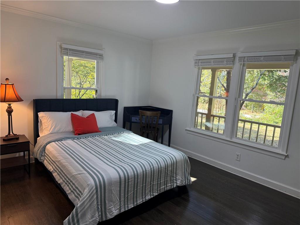 1140 Goodwin Place Northeast, Unit 4 Atlanta, GA 30319 - Photo 22 of 50 a bedroom with a bed and a window