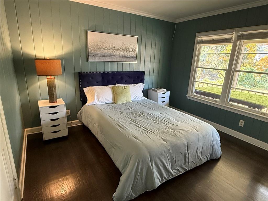 1140 Goodwin Place Northeast, Unit 4 Atlanta, GA 30319 - Photo 25 of 50 a bedroom with a bed and a lamp