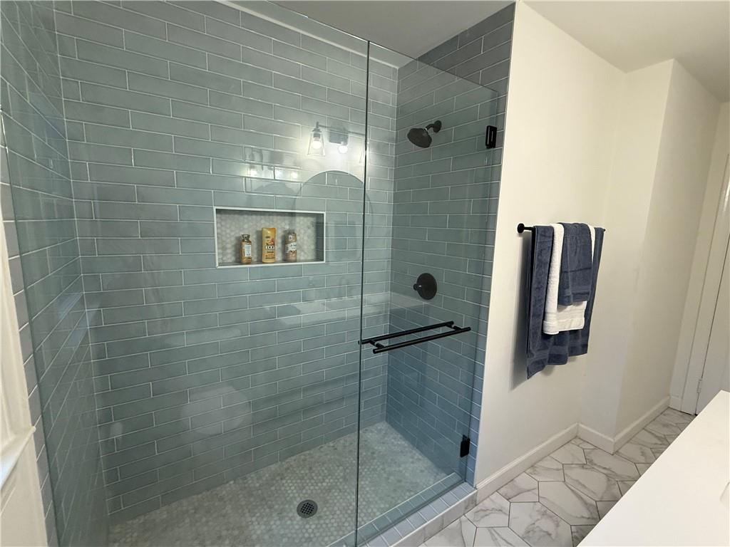 1140 Goodwin Place Northeast, Unit 4 Atlanta, GA 30319 - Photo 30 of 50 a bathroom with a shower