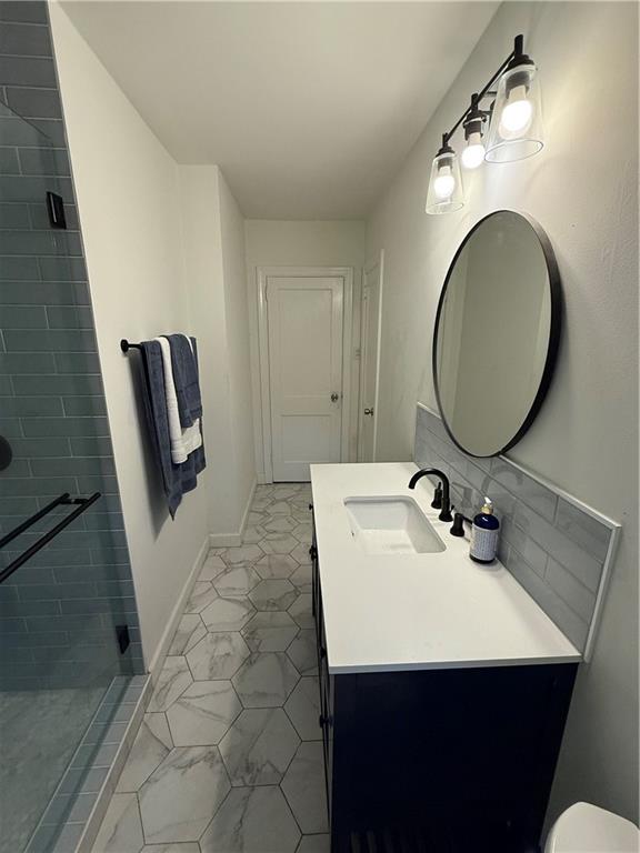 1140 Goodwin Place Northeast, Unit 4 Atlanta, GA 30319 - Photo 31 of 50 a bathroom with a sink and a mirror