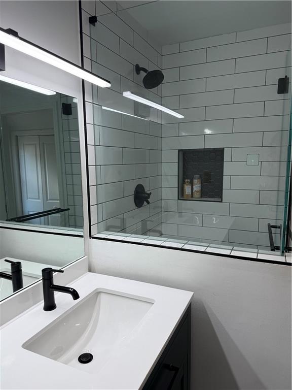 1140 Goodwin Place Northeast, Unit 4 Atlanta, GA 30319 - Photo 38 of 50 a bathroom with a sink and a mirror