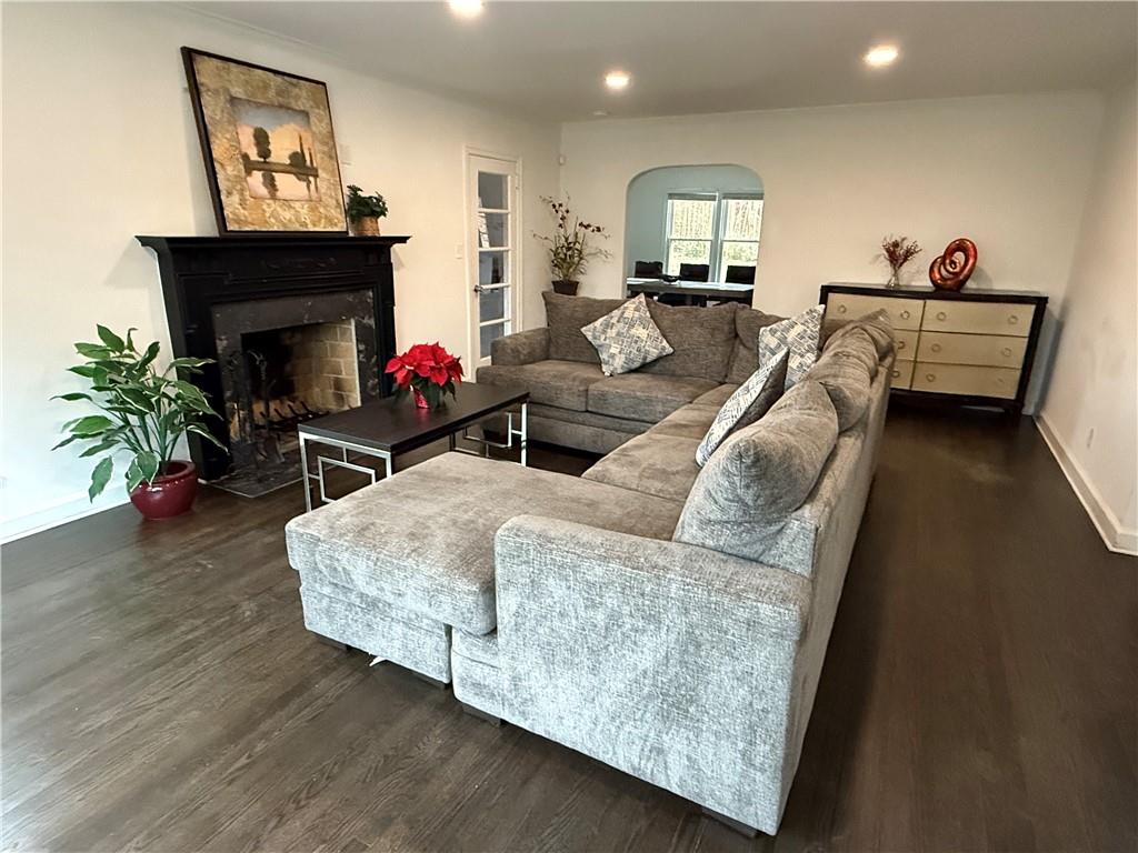 1140 Goodwin Place Northeast, Unit 4 Atlanta, GA 30319 - Photo 44 of 50 a living room with furniture and a fireplace