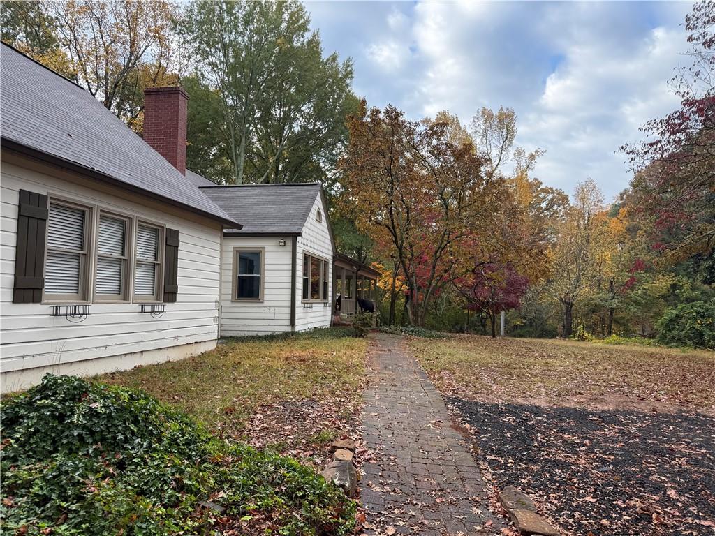 1140 Goodwin Place Northeast, Unit 4 Atlanta, GA 30319 - Photo 47 of 50 a view of a house with a yard and large tree