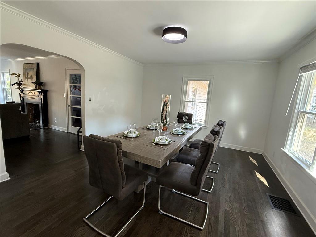 1140 Goodwin Place Northeast, Unit 4 Atlanta, GA 30319 - Photo 5 of 50 a view of a dining room with furniture and wooden floor