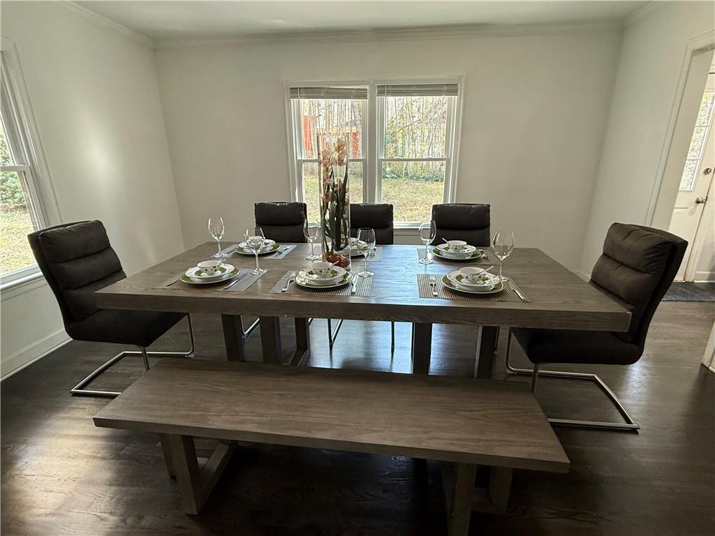 1140 Goodwin Place Northeast, Unit 4 Atlanta, GA 30319 - Photo 8 of 50 a view of a dining room with furniture window and wooden floor