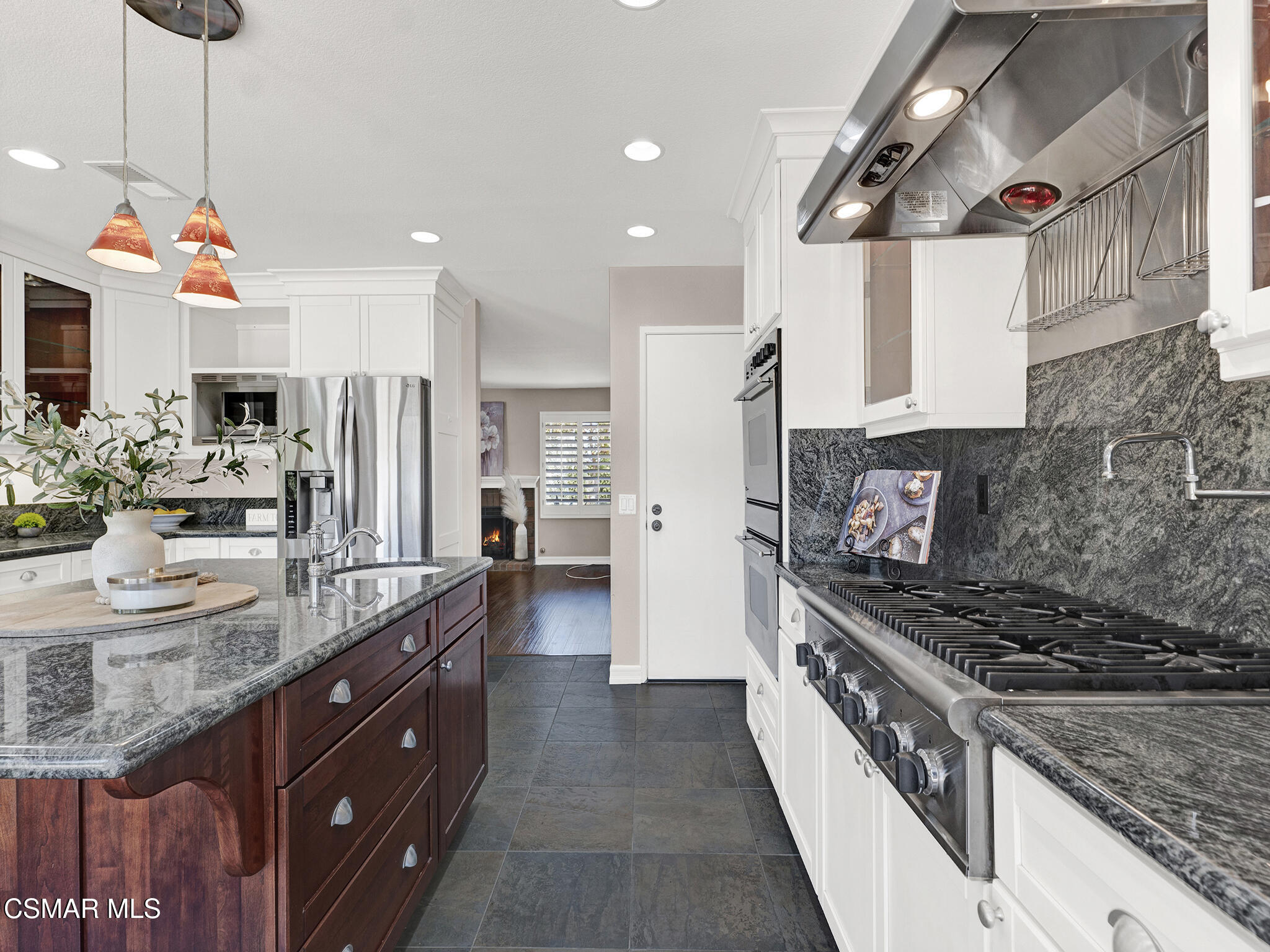 1506 Rambling Road Simi Valley, CA 93065 - Photo 12 of 79 a kitchen with stainless steel appliances granite countertop a sink and stove