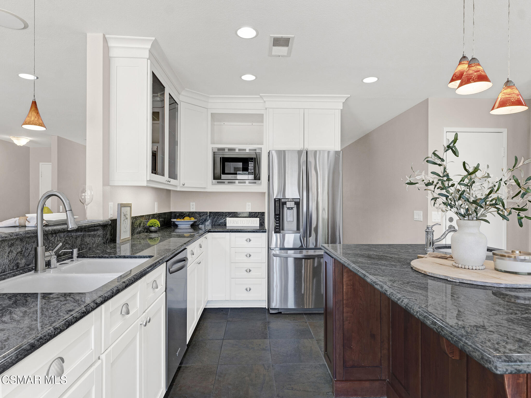 1506 Rambling Road Simi Valley, CA 93065 - Photo 13 of 79 a kitchen with stainless steel appliances granite countertop a sink refrigerator and microwave