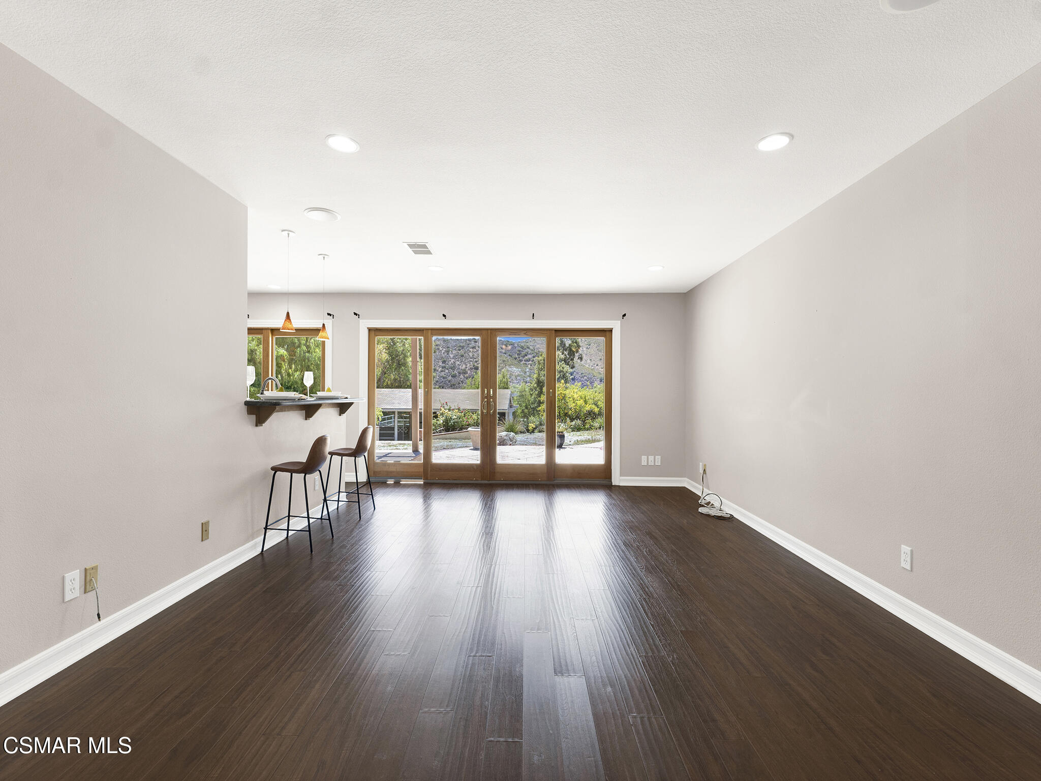 1506 Rambling Road Simi Valley, CA 93065 - Photo 16 of 79 an empty room with wooden floor and windows
