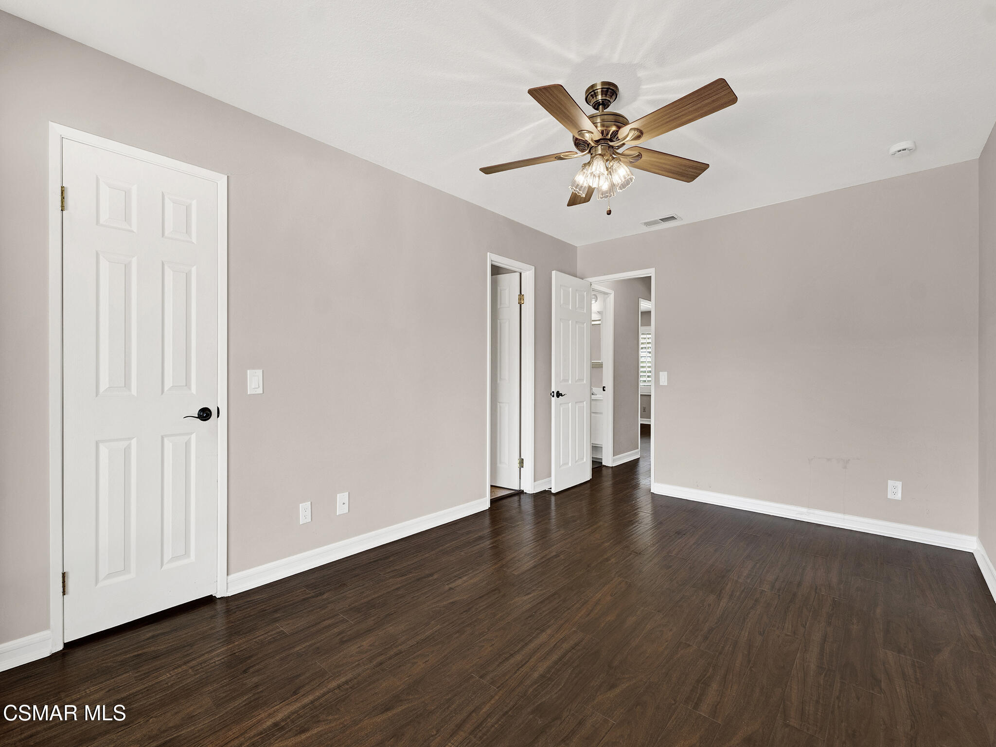 1506 Rambling Road Simi Valley, CA 93065 - Photo 18 of 79 an empty room with wooden floor and ceiling fan