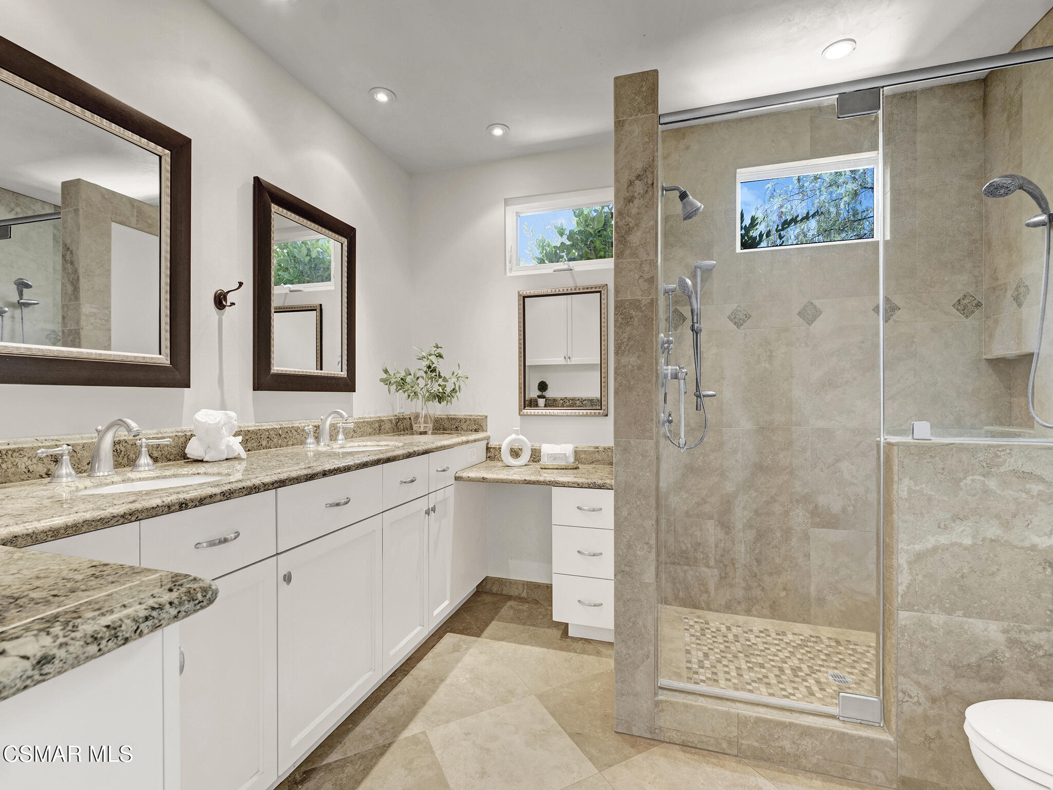 1506 Rambling Road Simi Valley, CA 93065 - Photo 19 of 79 a spacious bathroom with a granite countertop sink a toilet a mirror and shower