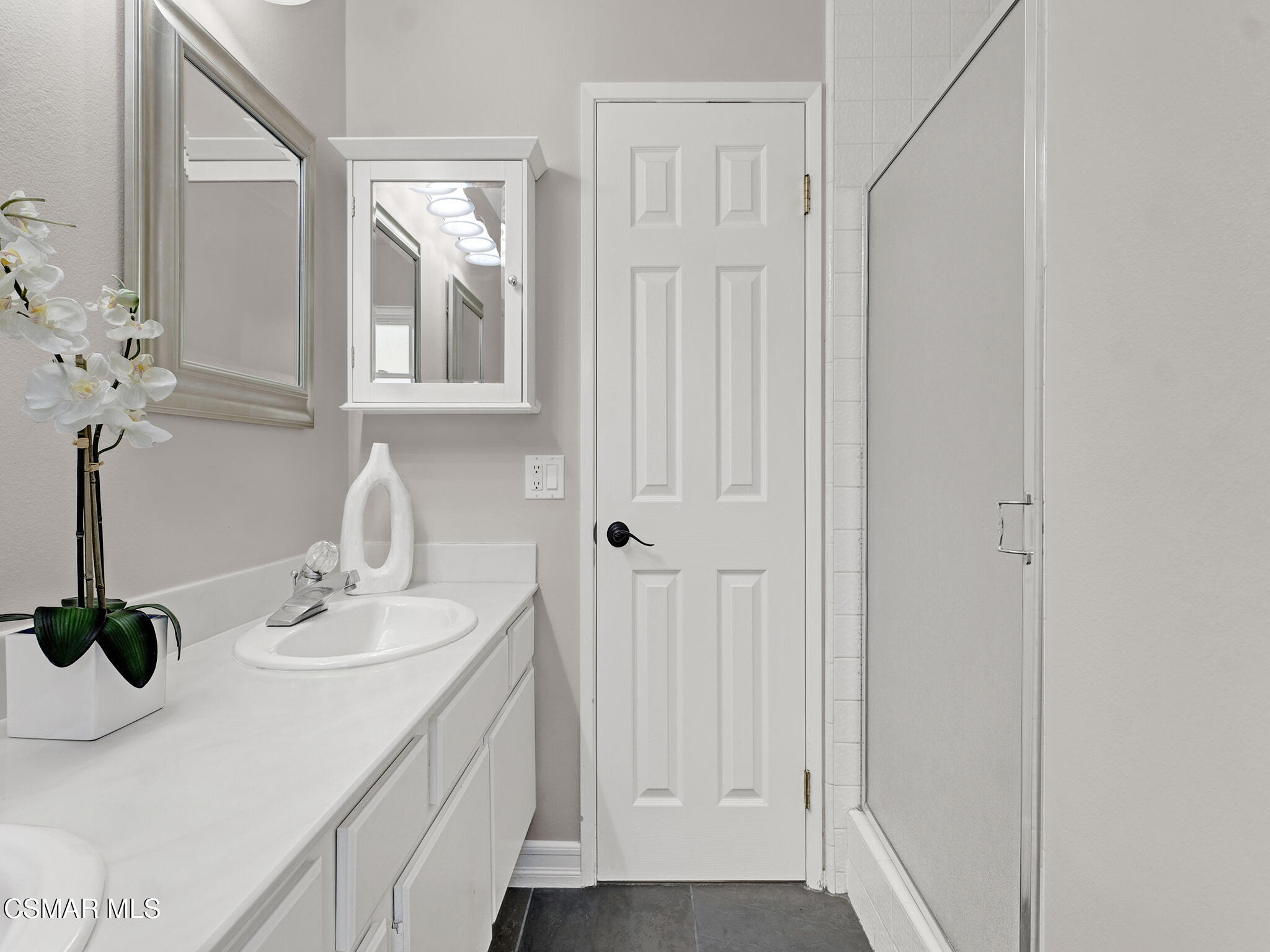 1506 Rambling Road Simi Valley, CA 93065 - Photo 24 of 79 a bathroom with a sink and a mirror