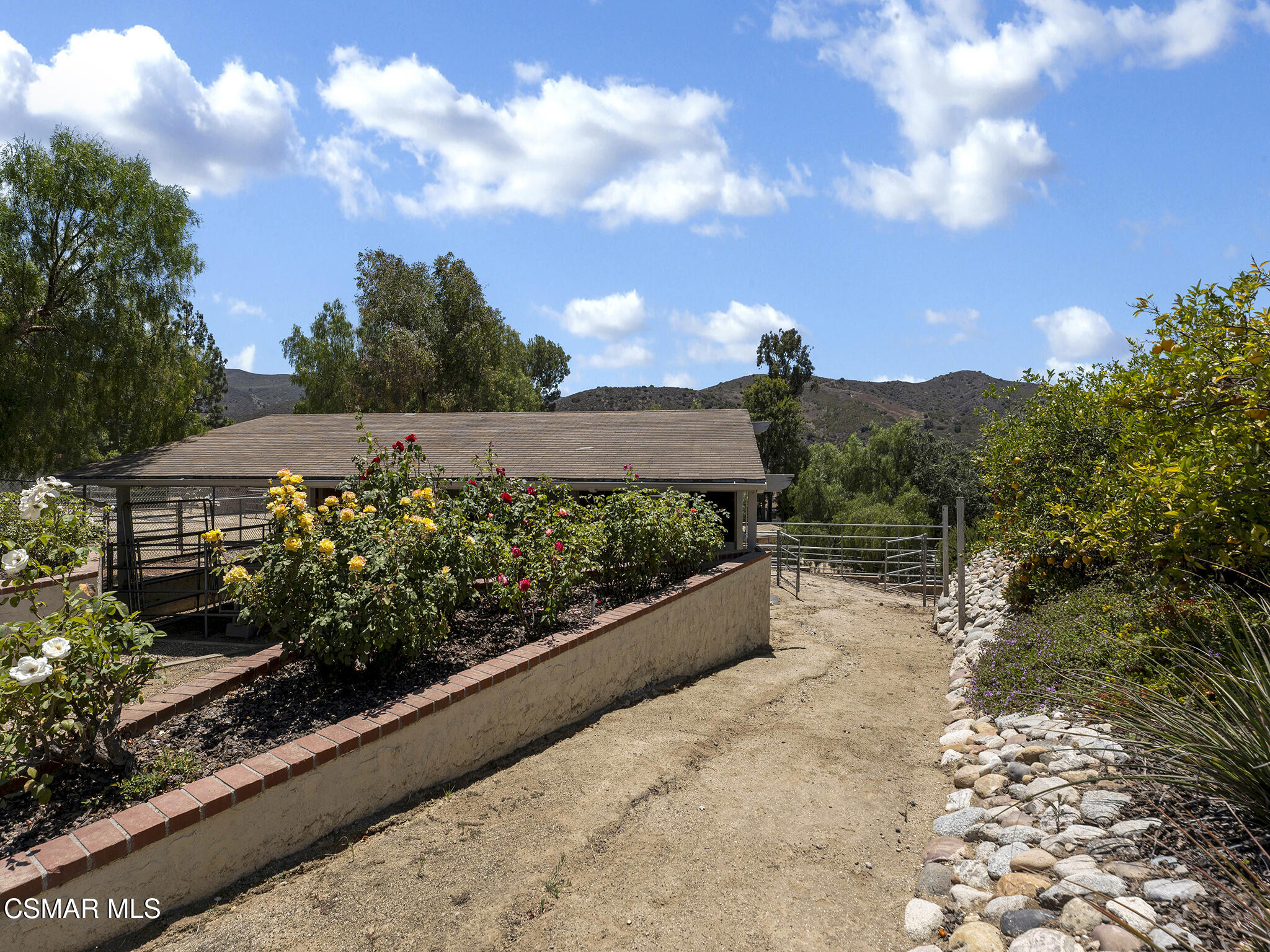 1506 Rambling Road Simi Valley, CA 93065 - Photo 51 of 79 a view of a garden with a pathway