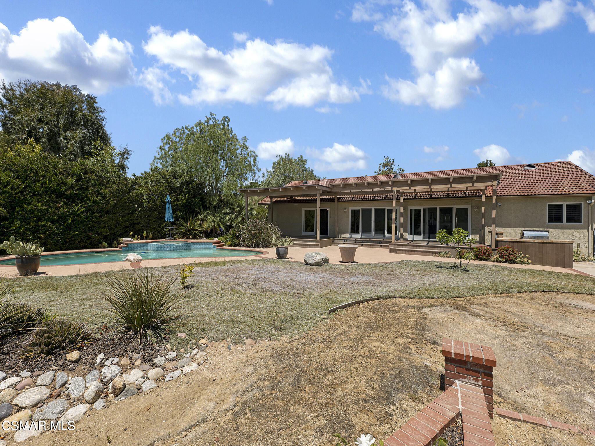 1506 Rambling Road Simi Valley, CA 93065 - Photo 53 of 79 a view of a house with swimming pool and a yard
