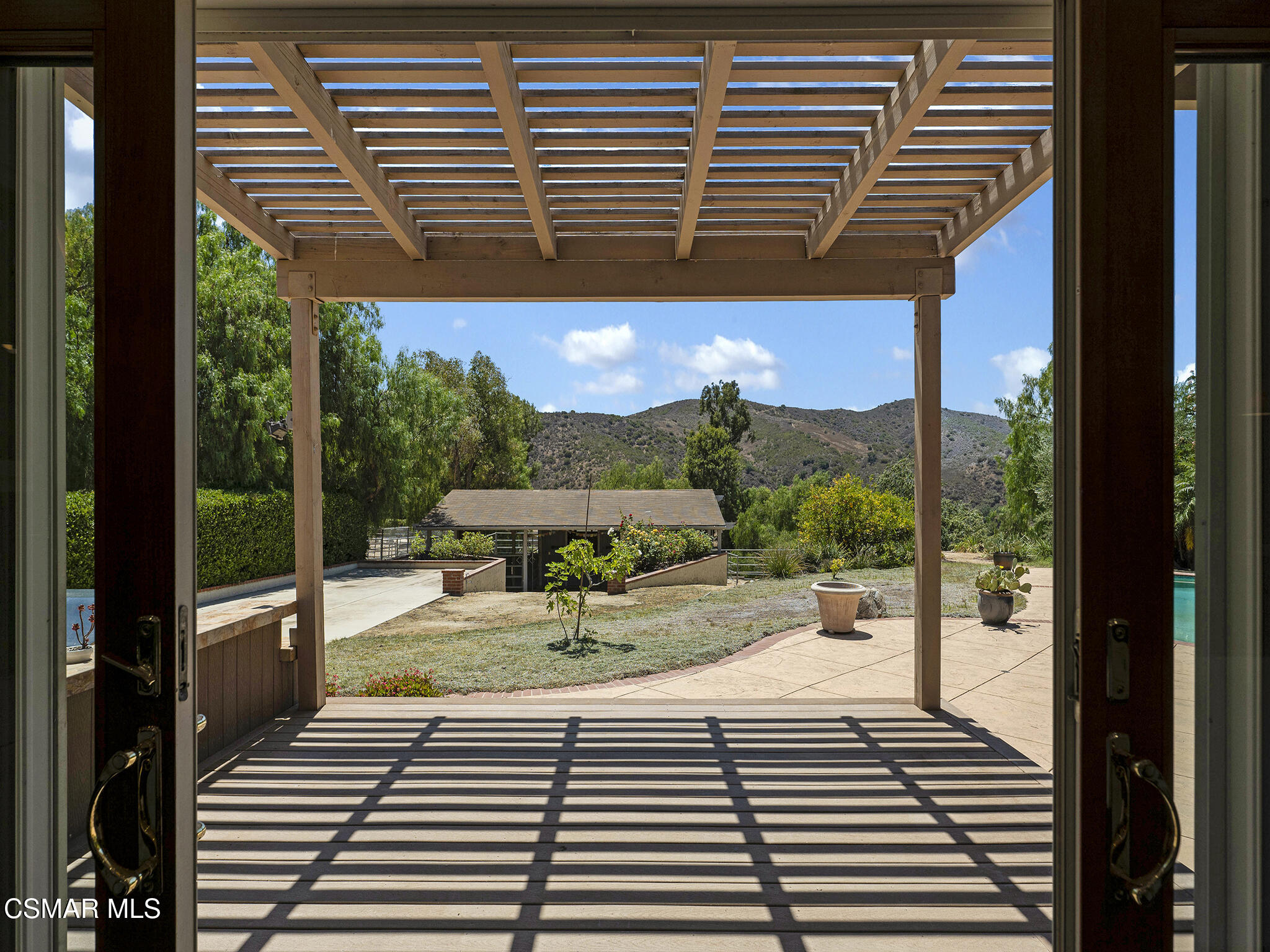 1506 Rambling Road Simi Valley, CA 93065 - Photo 62 of 79 a view of a patio with a table and chairs