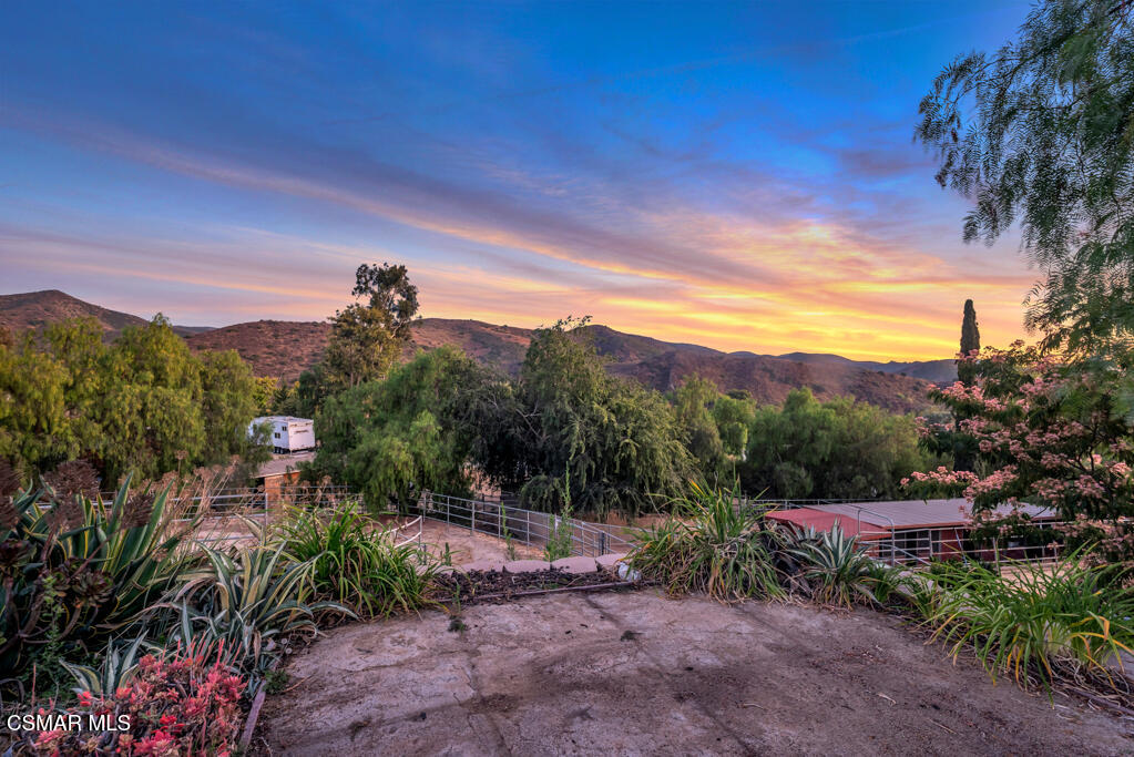 1506 Rambling Road Simi Valley, CA 93065 - Photo 64 of 79 a view of a street with a yard