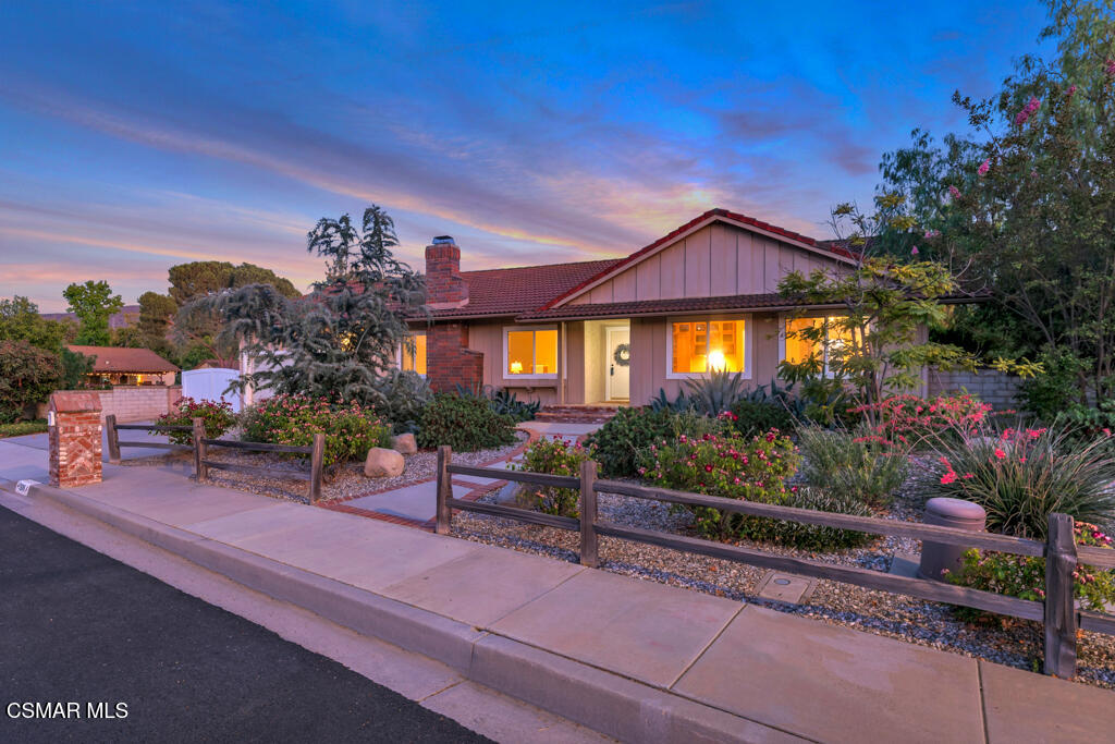 1506 Rambling Road Simi Valley, CA 93065 - Photo 71 of 79 a wooden bench sitting in front of a house