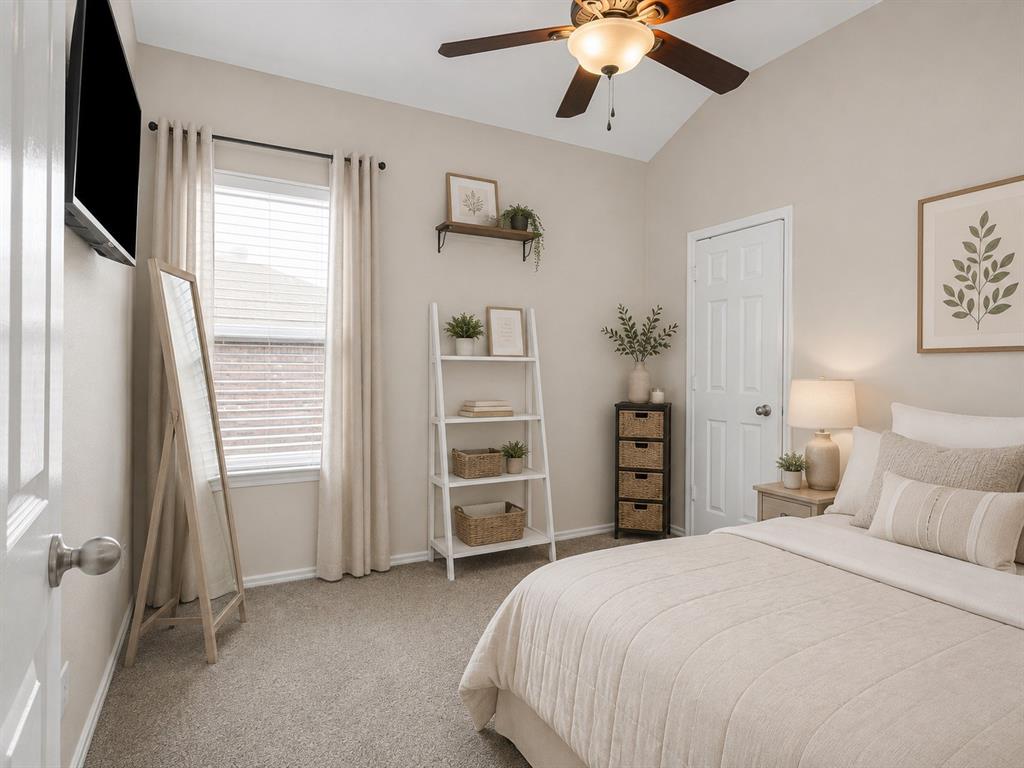 205 King George Road Ponder, TX 76259 - Photo 23 of 37 Vaulted ceiling with a ceiling fan, window with blinds and drapes, wall-mounted television, and carpet flooring