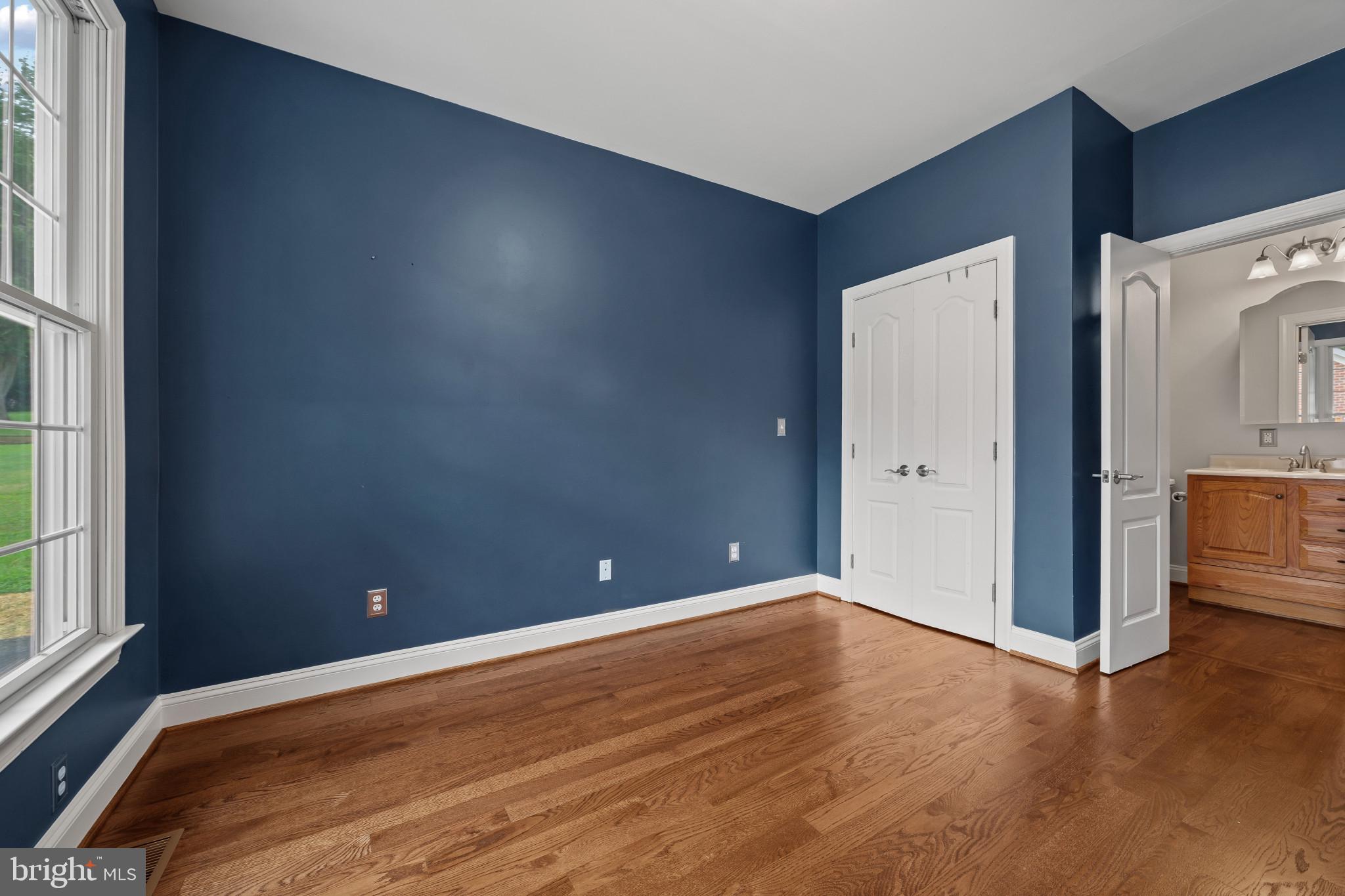 12221 Jerusalem Road Kingsville, MD 21087 - Photo 19 of 66 a view of room with window and wooden floor
