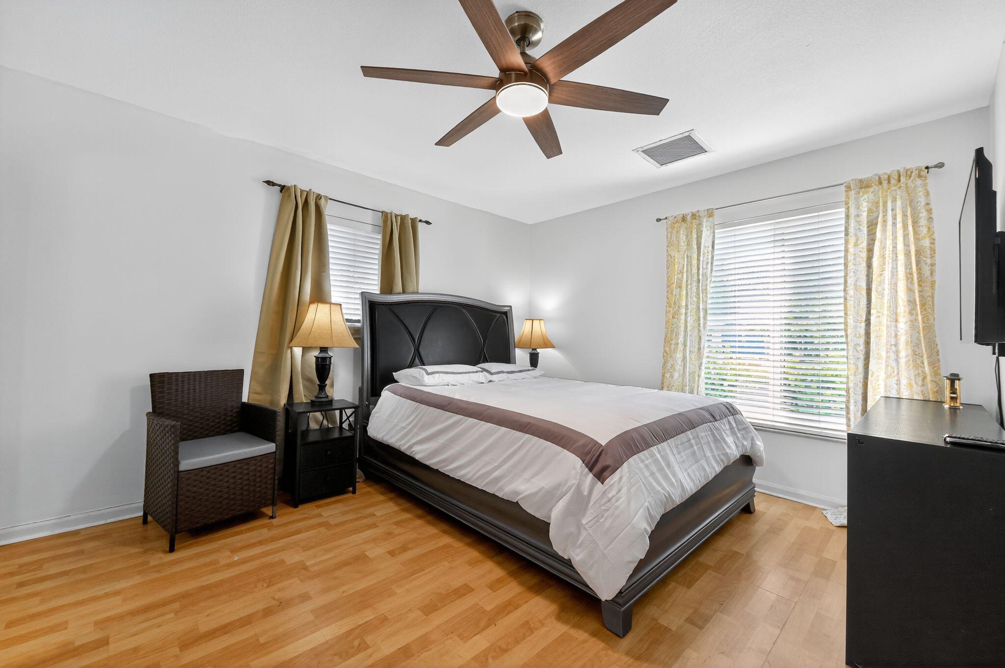 407 Highwood Circle Jupiter, FL 33458 - Photo 20 of 30 a bedroom with bed and window