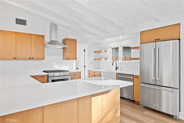 a large kitchen with granite countertop a stove oven and a sink with granite countertops