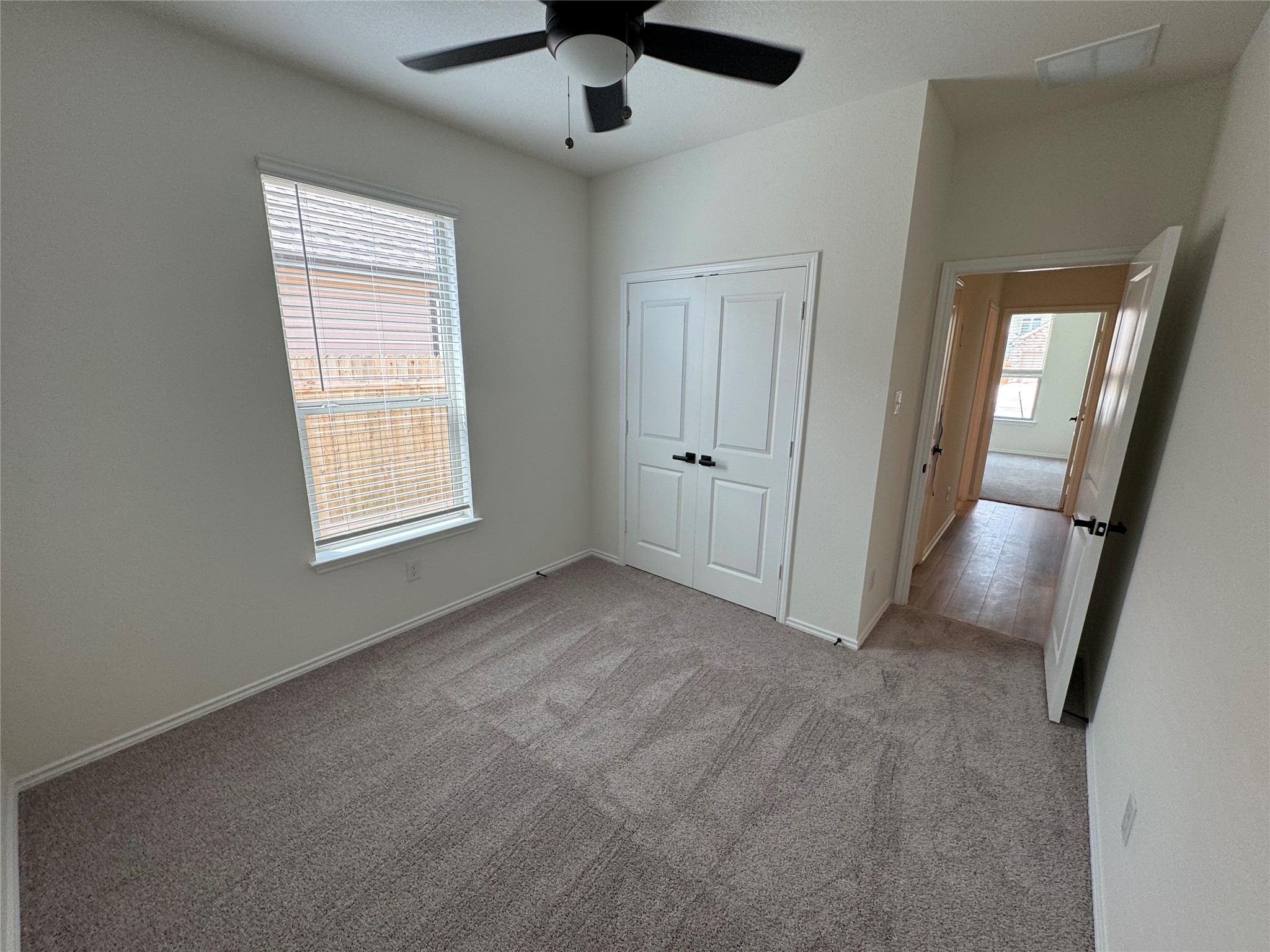 216 Coastal Way Georgetown, TX 78628 - Photo 11 of 38 an empty room with windows and fan