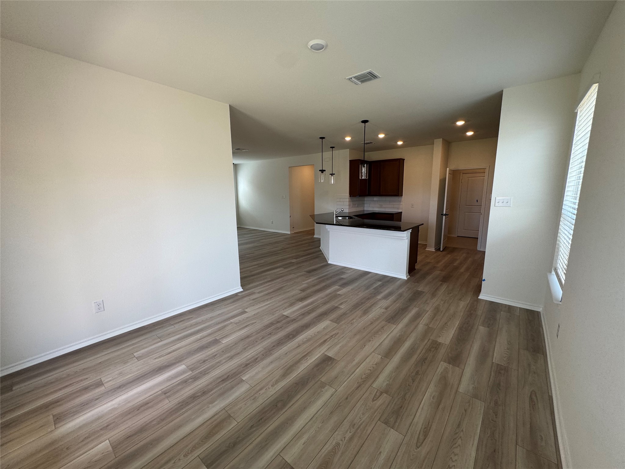 216 Coastal Way Georgetown, TX 78628 - Photo 38 of 38 a view of a living room with wooden floor and a ceiling fan