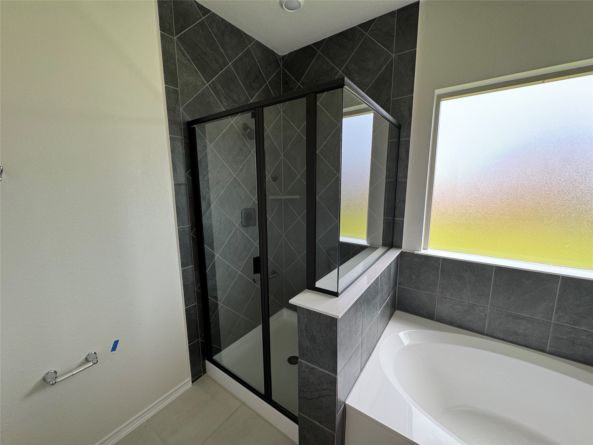 216 Coastal Way Georgetown, TX 78628 - Photo 24 of 38 a bathroom with a tub and sink