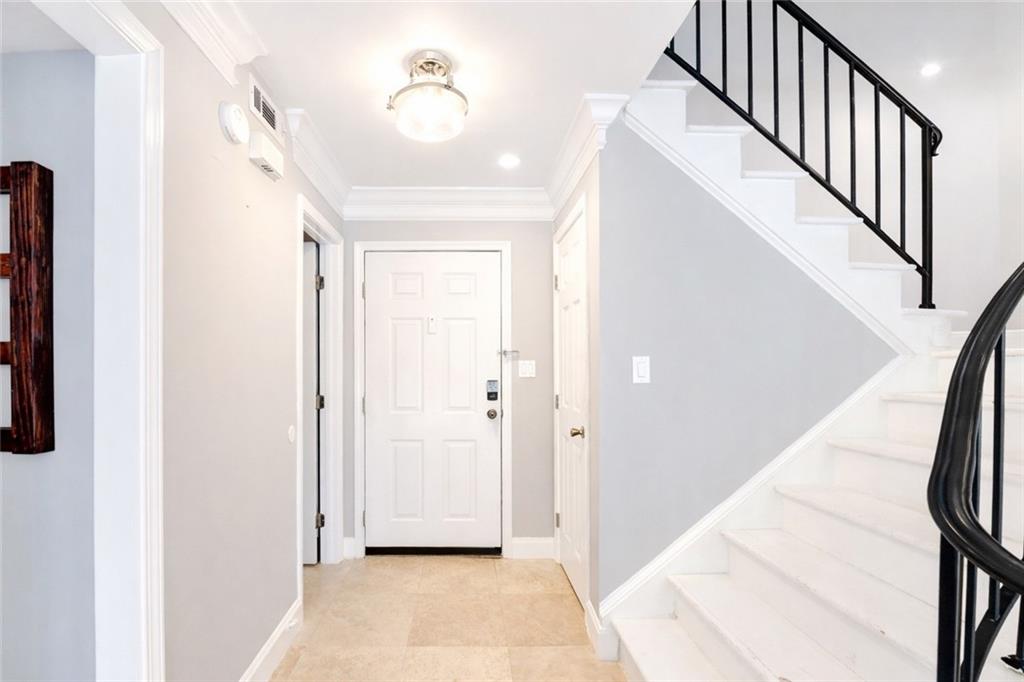 6980 Roswell Road, Unit C5 Atlanta, GA 30328 - Photo 3 of 22 a view of a hallway with entryway and stairs