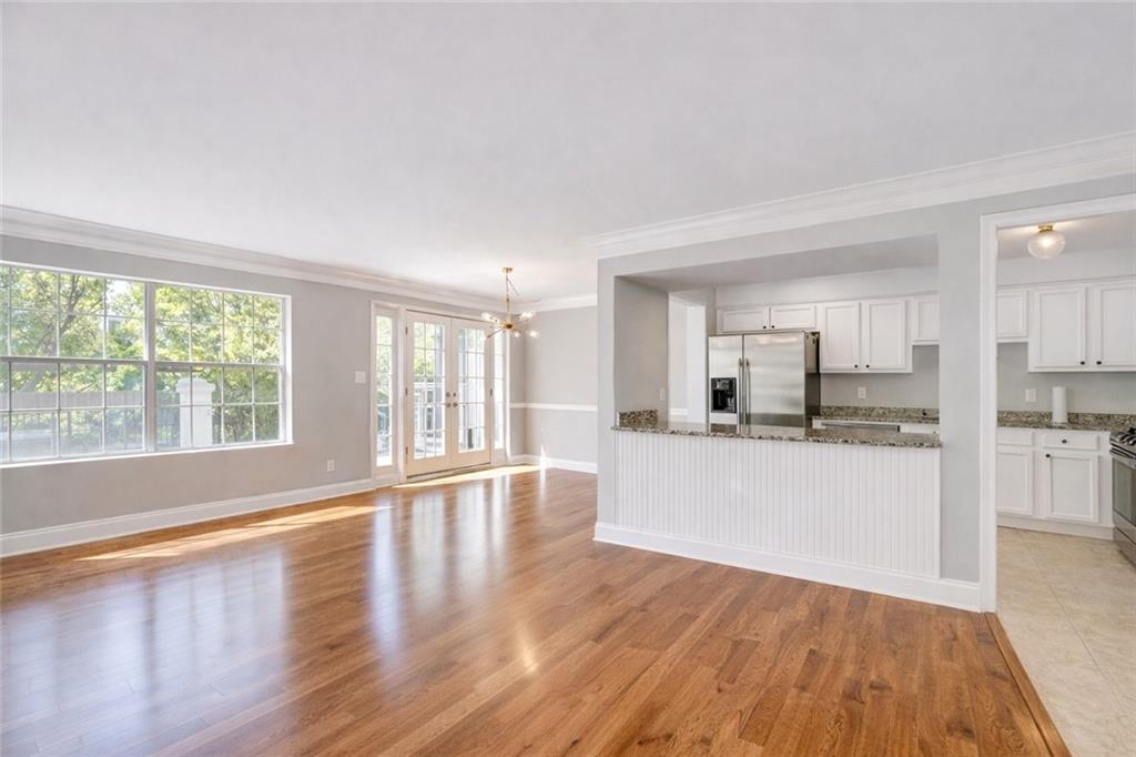 6980 Roswell Road, Unit C5 Atlanta, GA 30328 - Photo 5 of 22 a view of large kitchen with wooden floor and outdoor space
